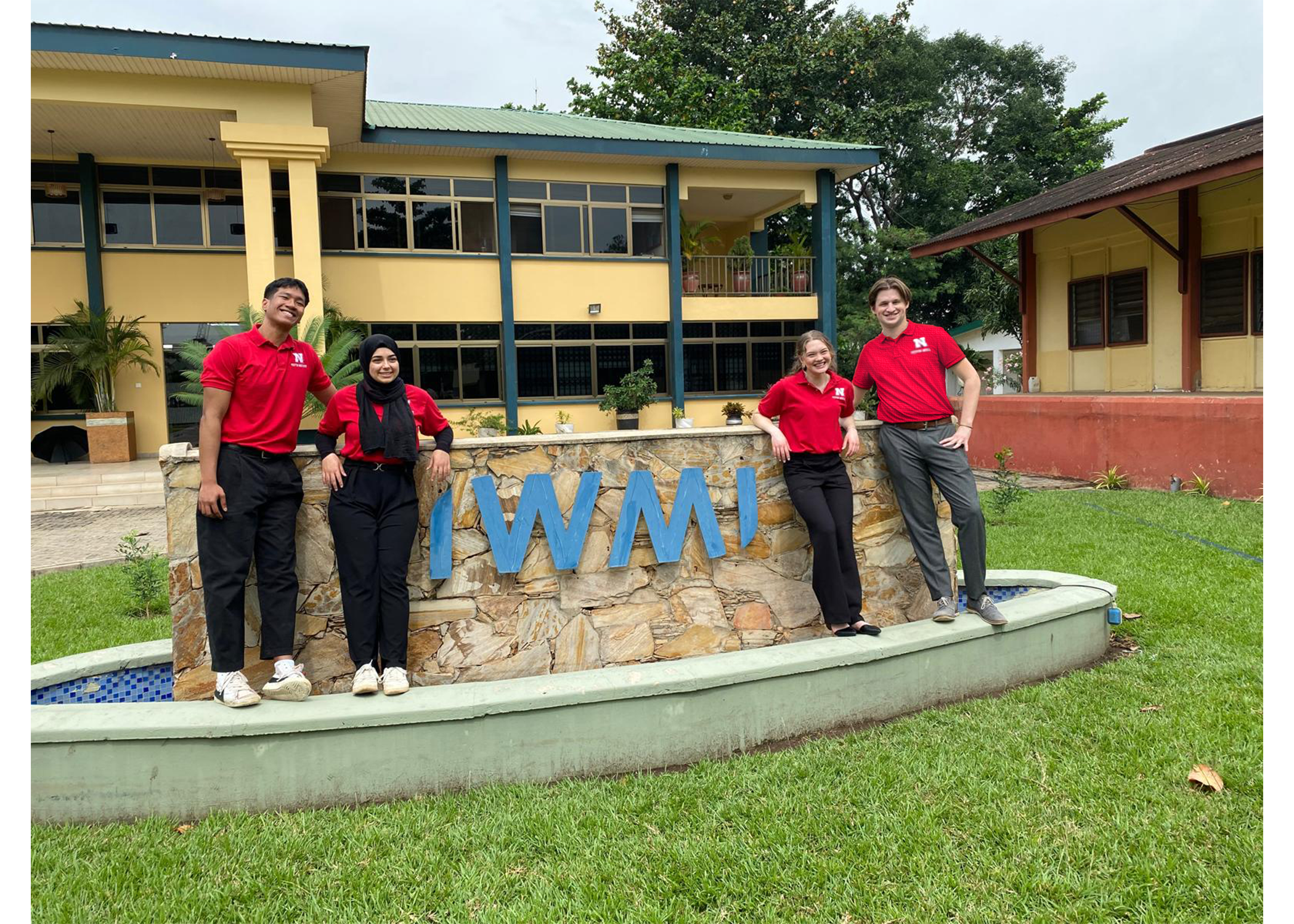 People in front of sign