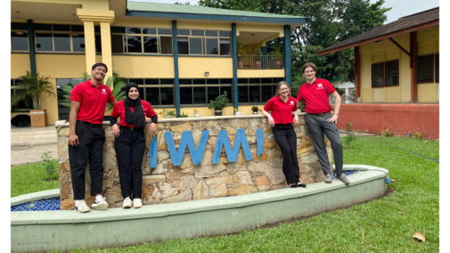 People in front of sign