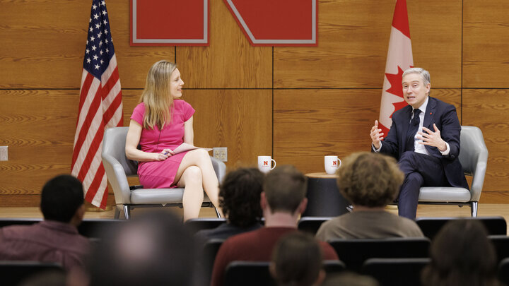 Jill O'Donnell and François-Philippe Champagne sit on stage in the Nebraska Union's Swanson Auditorium.